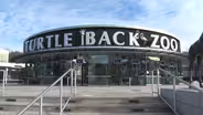 Why are neighbors trying to halt Turtle Back Zoo expansion?