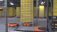 Robots assemble your packages at this new Amazon center