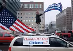 Crowds protest restrictions as health experts warn of risks