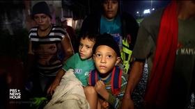 Video thumbnail: PBS NewsHour Why families by the thousands are fleeing Honduras for U.S.