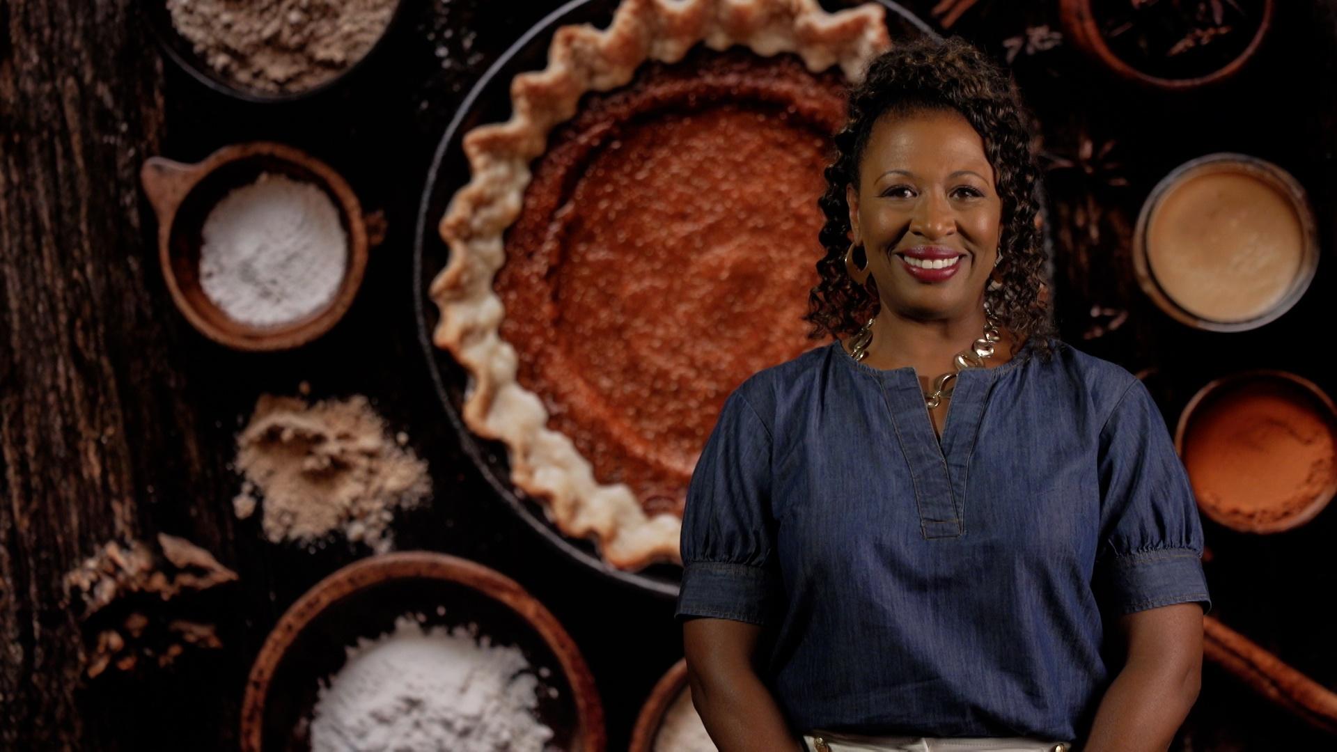 Host Deborah Holt Noel in front of an image of pumpkin pie.