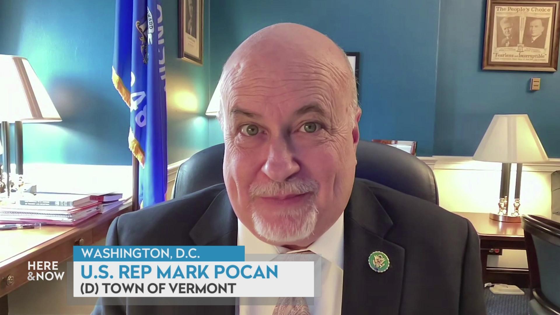 A still image from a video shows Mark Pocan seated in an office with blue walls and lamps on either side of him and a Wisconsin state flag with a graphic at bottom reading 'Washington, D.C.,' 'Mark Pocan' and '(D) Town of Vermont.'