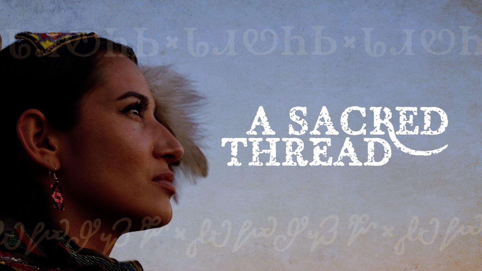 Angelina Jumper Huckleberry with the text, "A SACRED THREAD," to the right of her.