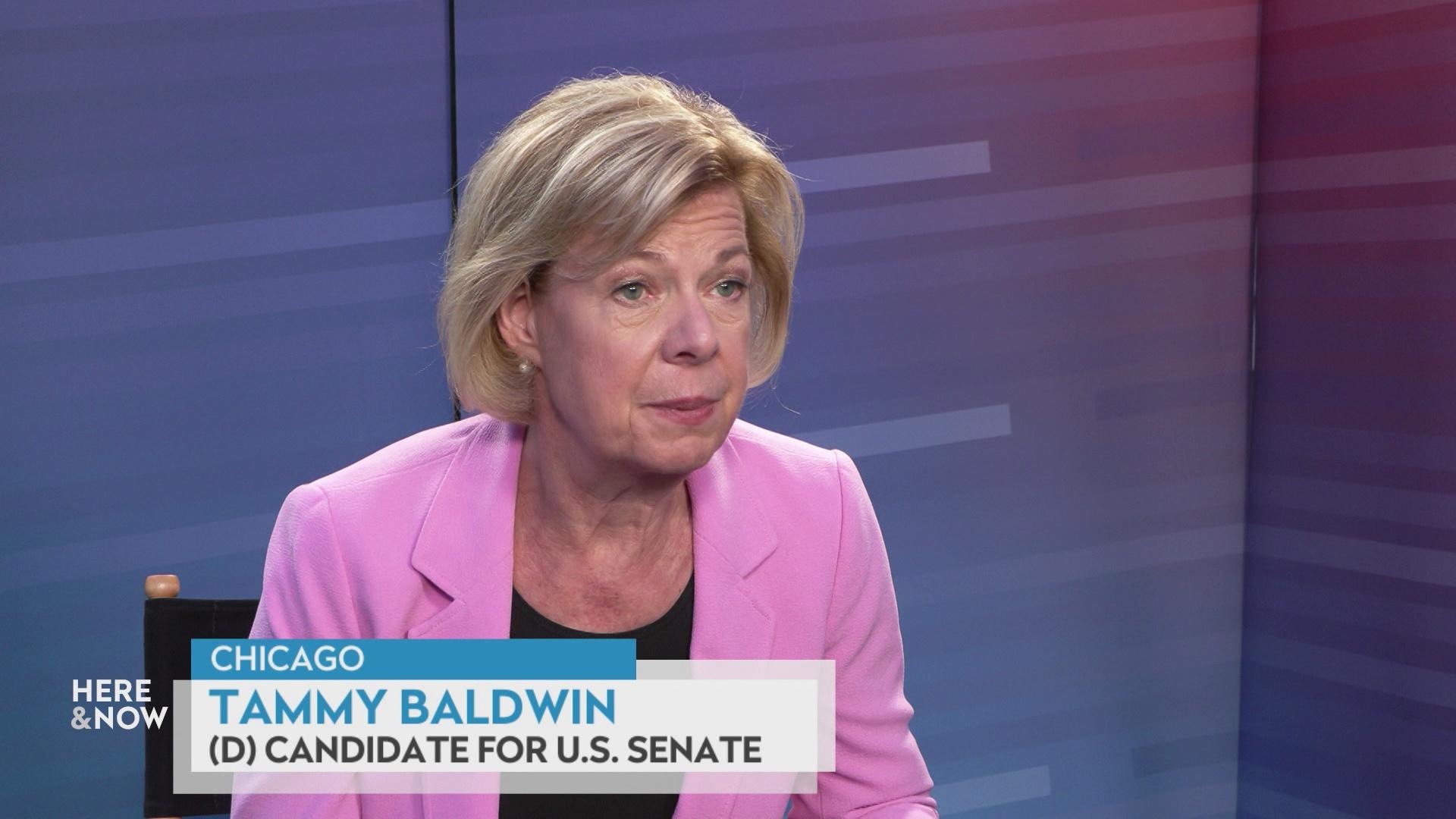 Tammy Baldwin sits and speaks with a gradient background with a graphic at bottom reading 'Chicago,' 'Tammy Baldwin' and '(D) Candidate for U.S. Senate.'