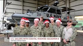 Video thumbnail: PBS NewsHour Holiday song from American troops around the world