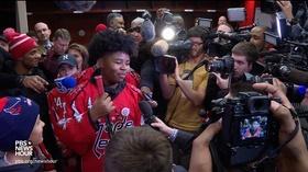 Video thumbnail: PBS NewsHour After racist taunts, hockey team rallies behind teammate