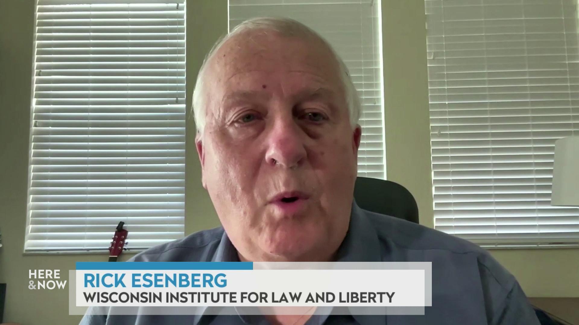 A still image from a video shows Rick Esenberg seated in front of a wall with three panels of blinds with a graphic at bottom reading 'Rick Esenberg' and 'Wisconsin Institute for Law and Liberty.'