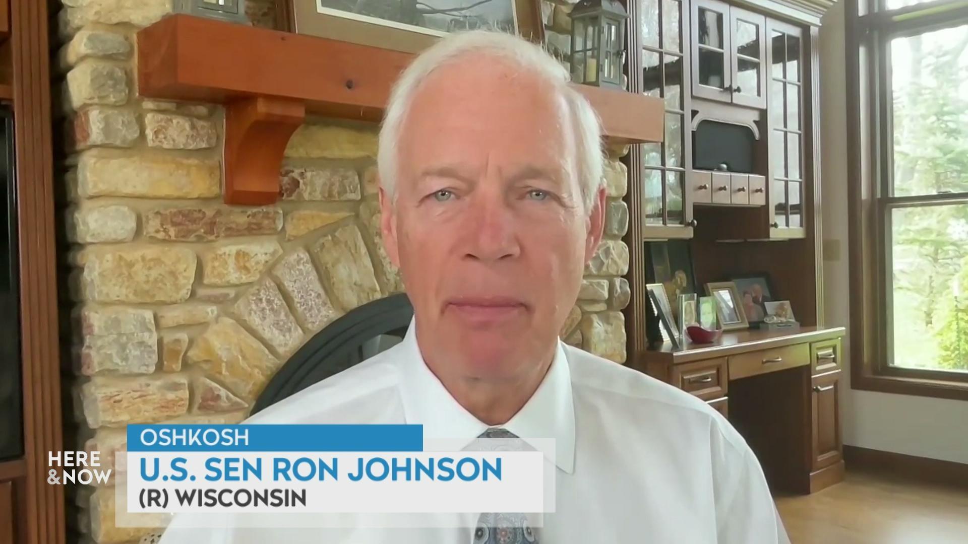 A still image shows Ron Johnson seated in front of a brick fireplace, with a graphic at the bottom that reads 'Oshkosh,' 'U.S. Sen. Ron Johnson' and '(R) Wisconsin.'