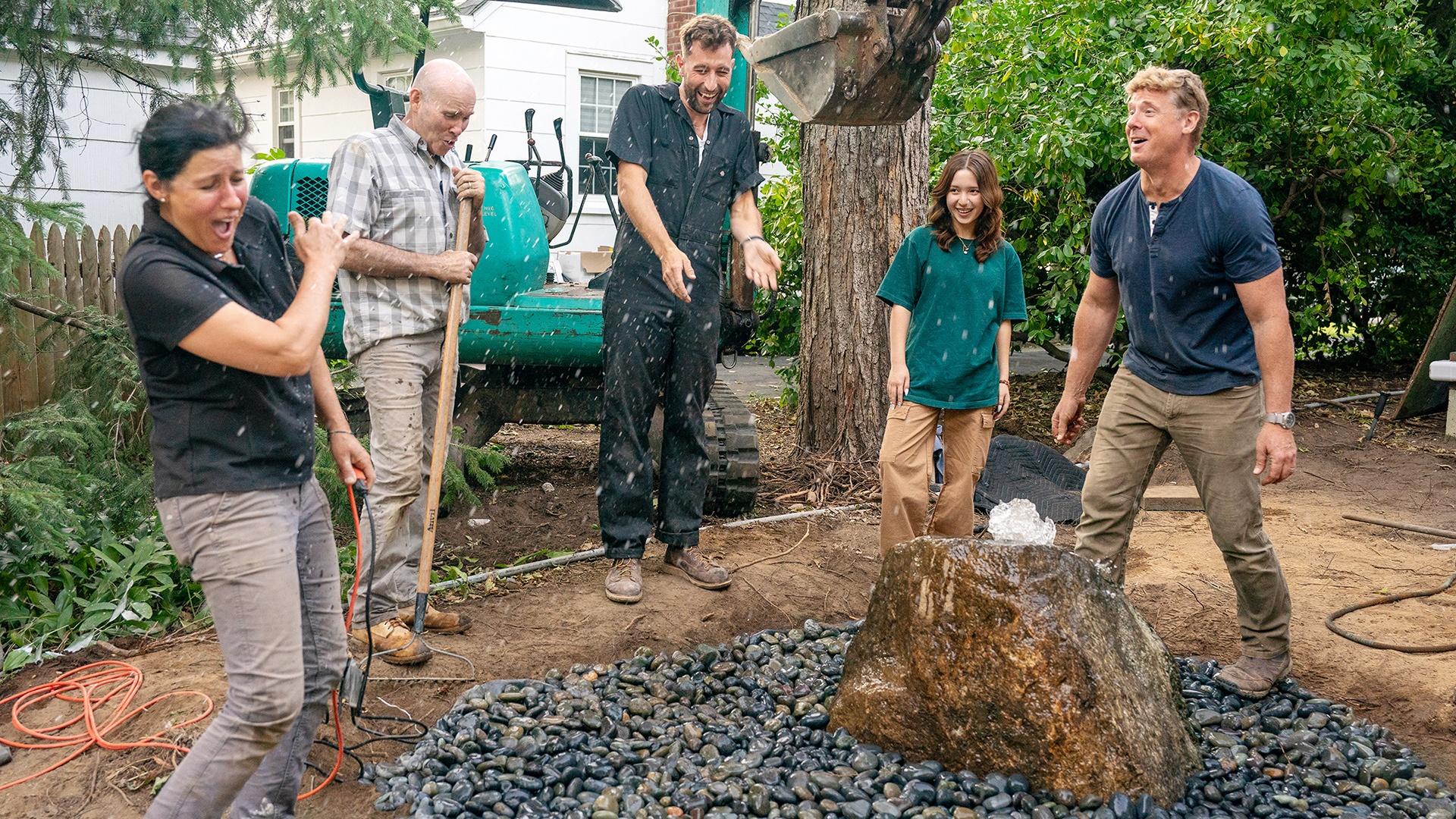 Jenn and Mark team up to install a custom-made water feature for the backyard patio.