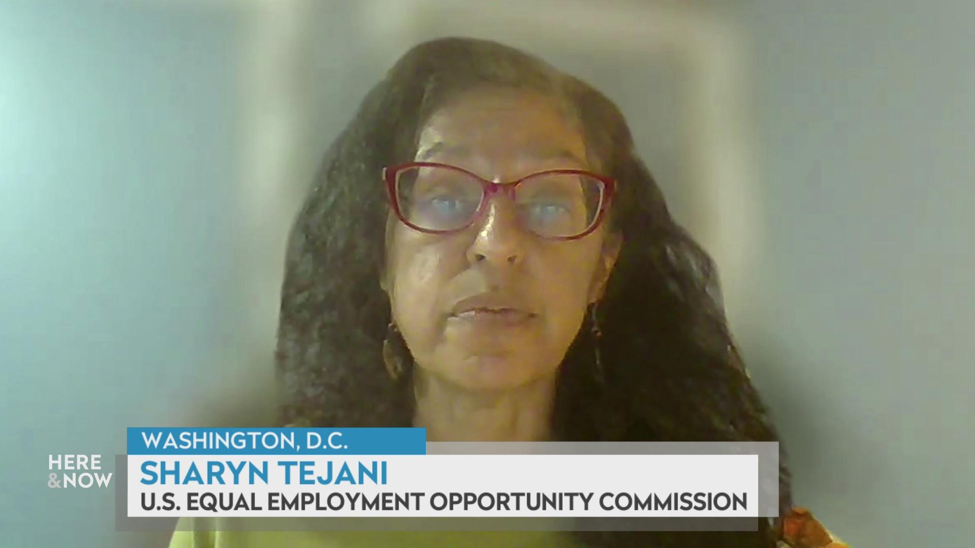 A still image from a video shows Sharyn Tejani in front of a dark, blurred screen with a graphic at bottom reading 'Washington, D.C.' 'Sharyn Tejani' and 'U.S. Equal Employment Opportunity Commission.'