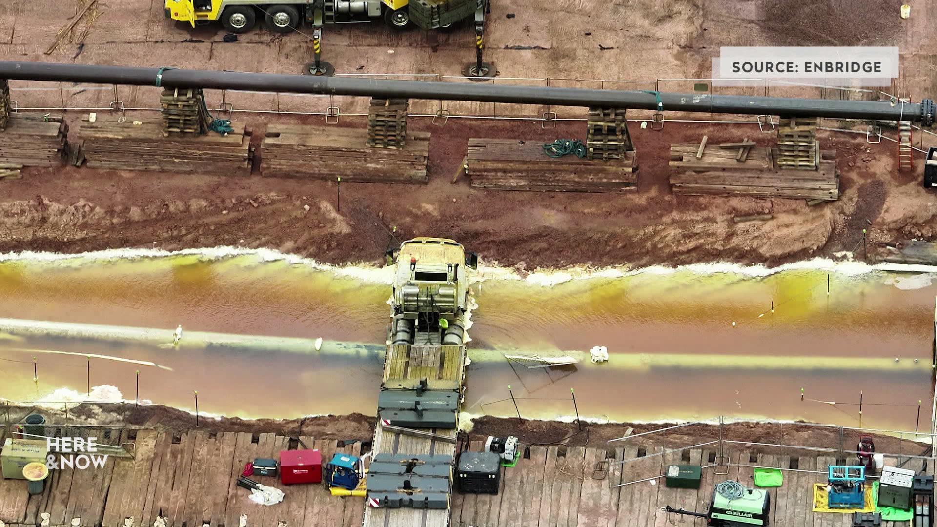 A still image shows an aerial shot of a the clean up site of the natural gas leak spewing from Enbridge's Line 5 pipeline.