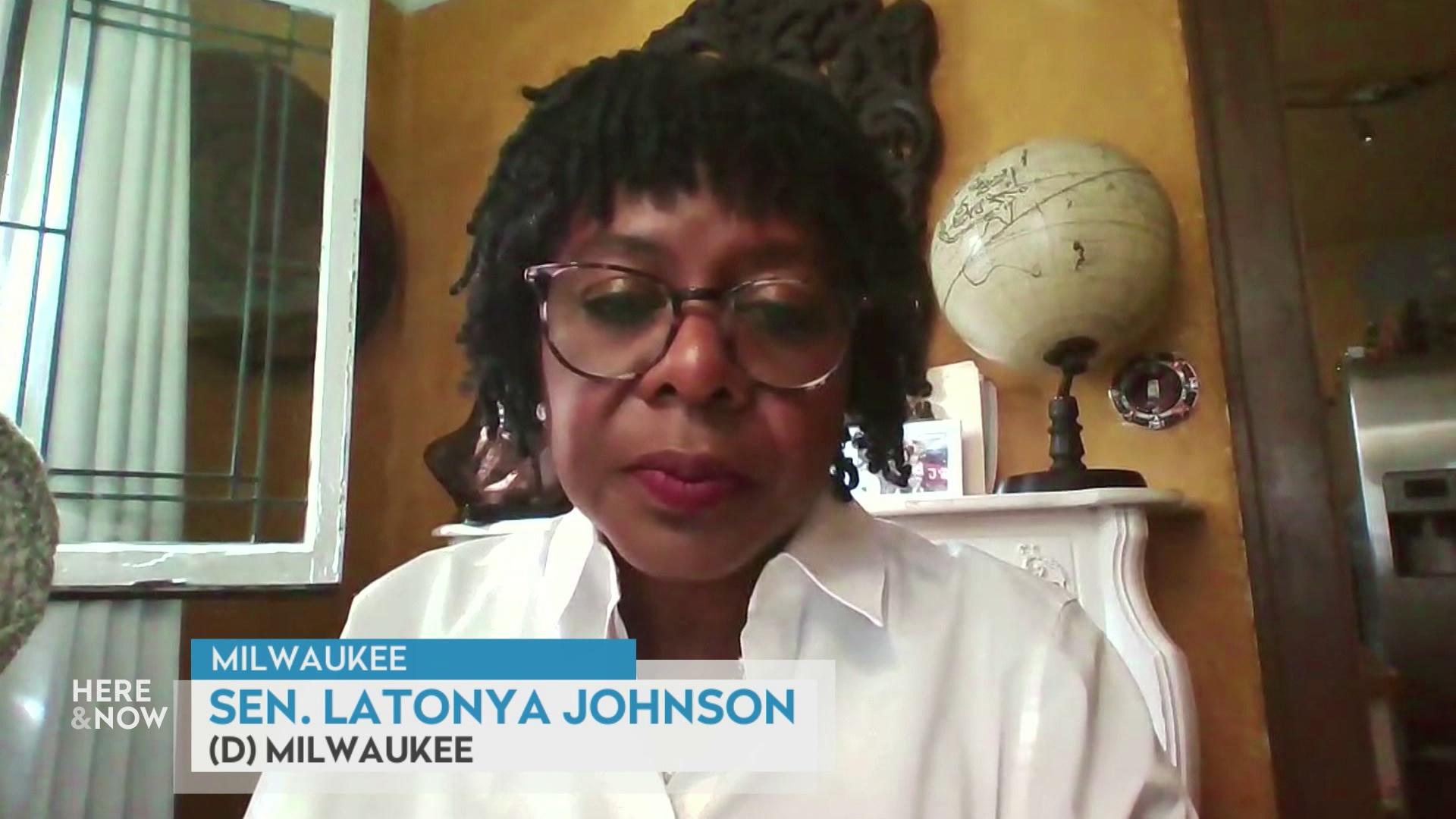 A still image from a video shows LaTonya Johnson seated in front of a fireplace with a globe on the shelf with a graphic at bottom reading 'Milwaukee,' 'Sen. LaTonya Johnson' and '(D) Milwaukee.'