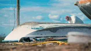 A Local Fisherman Works to Restore Damaged Boats