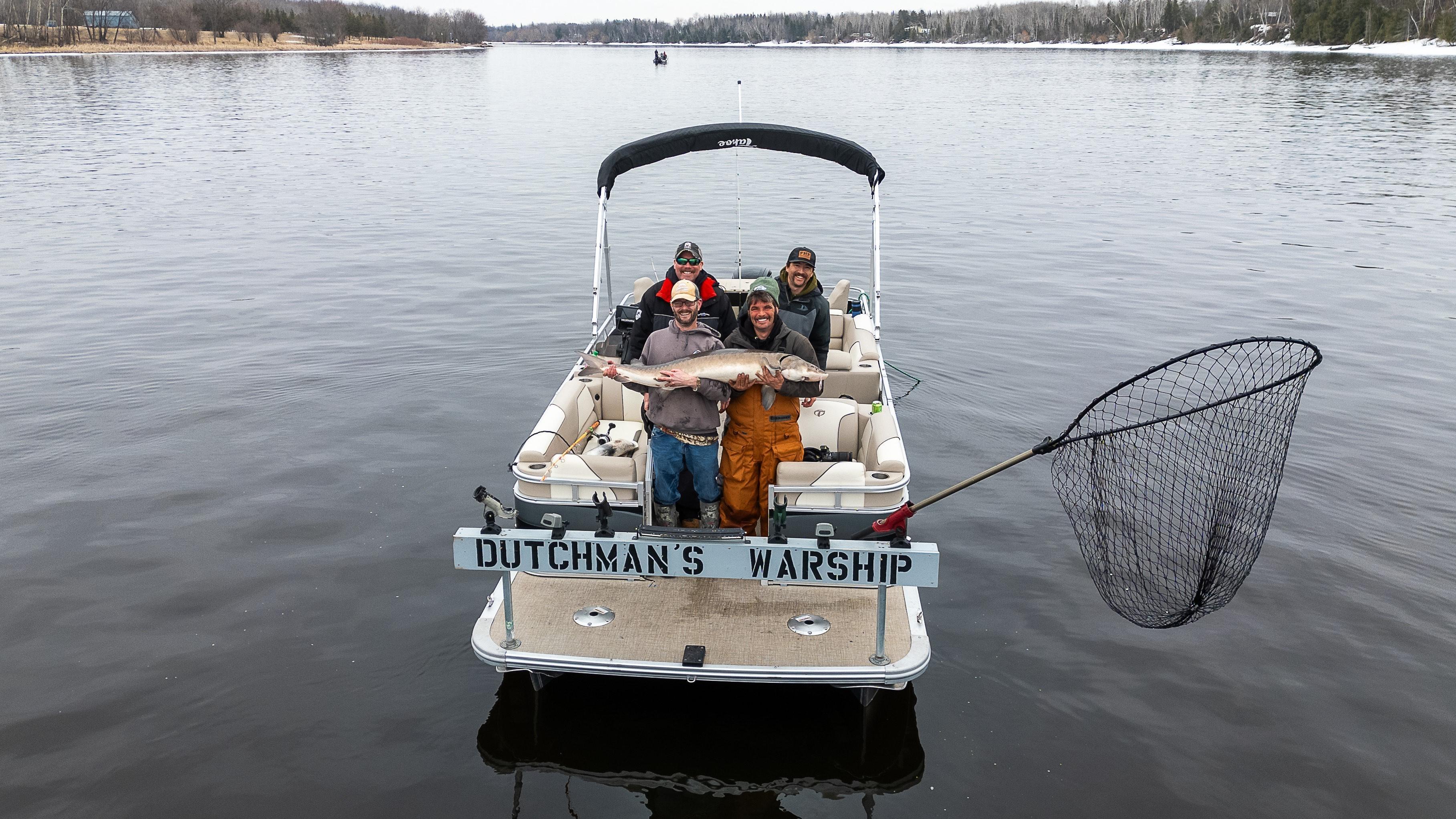 Kevin Hinrichs of the Royal Dutchman Resort battles monster sturgeon. Then, DNR studies the fish.
