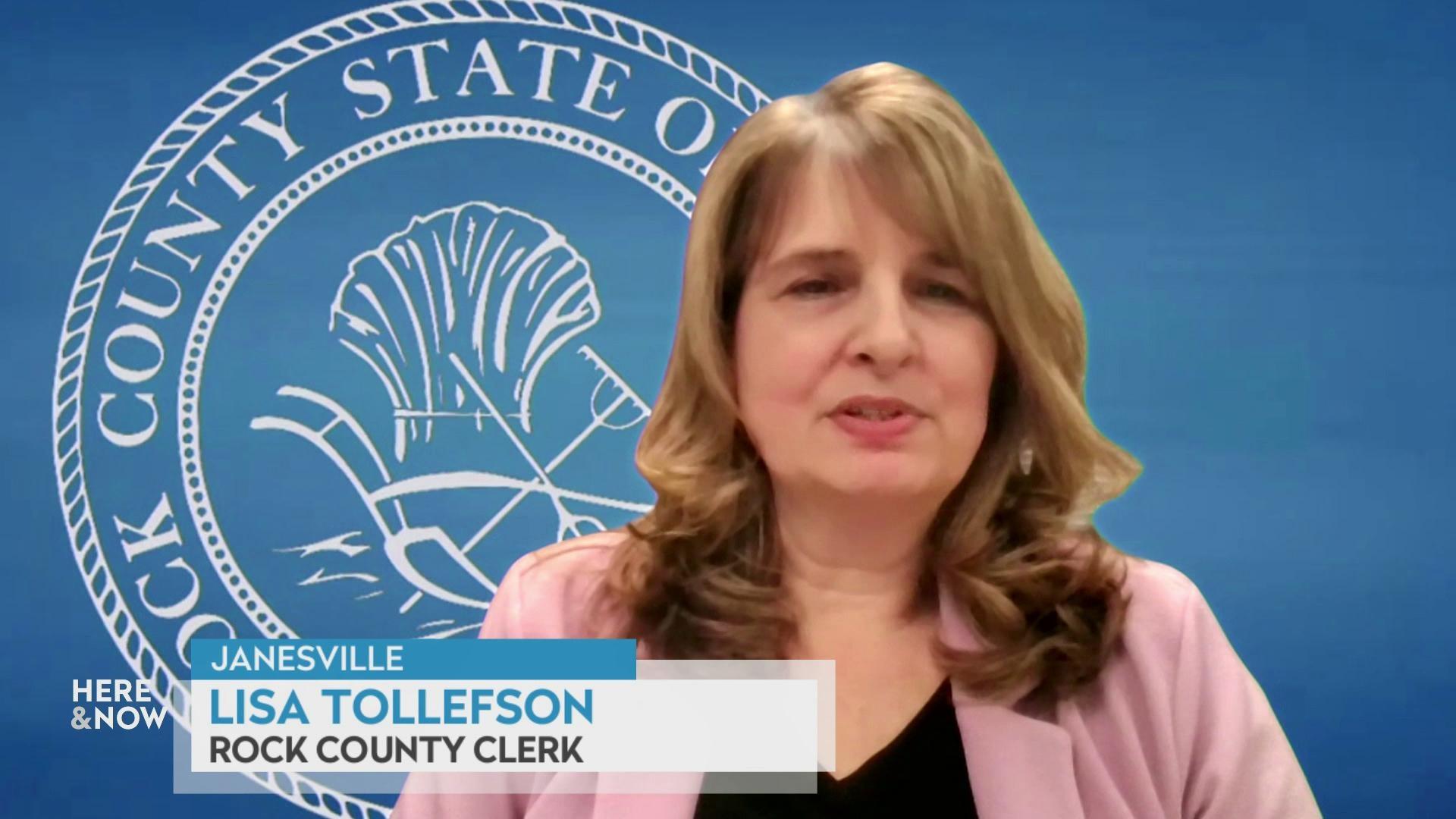 A still image shows Lisa Tollefson seated in front of a graphic of the Rock county sigil with a graphic at the bottom that reads 'Janesville,' 'Lisa Tollefson' and 'Rock County Clerk.'