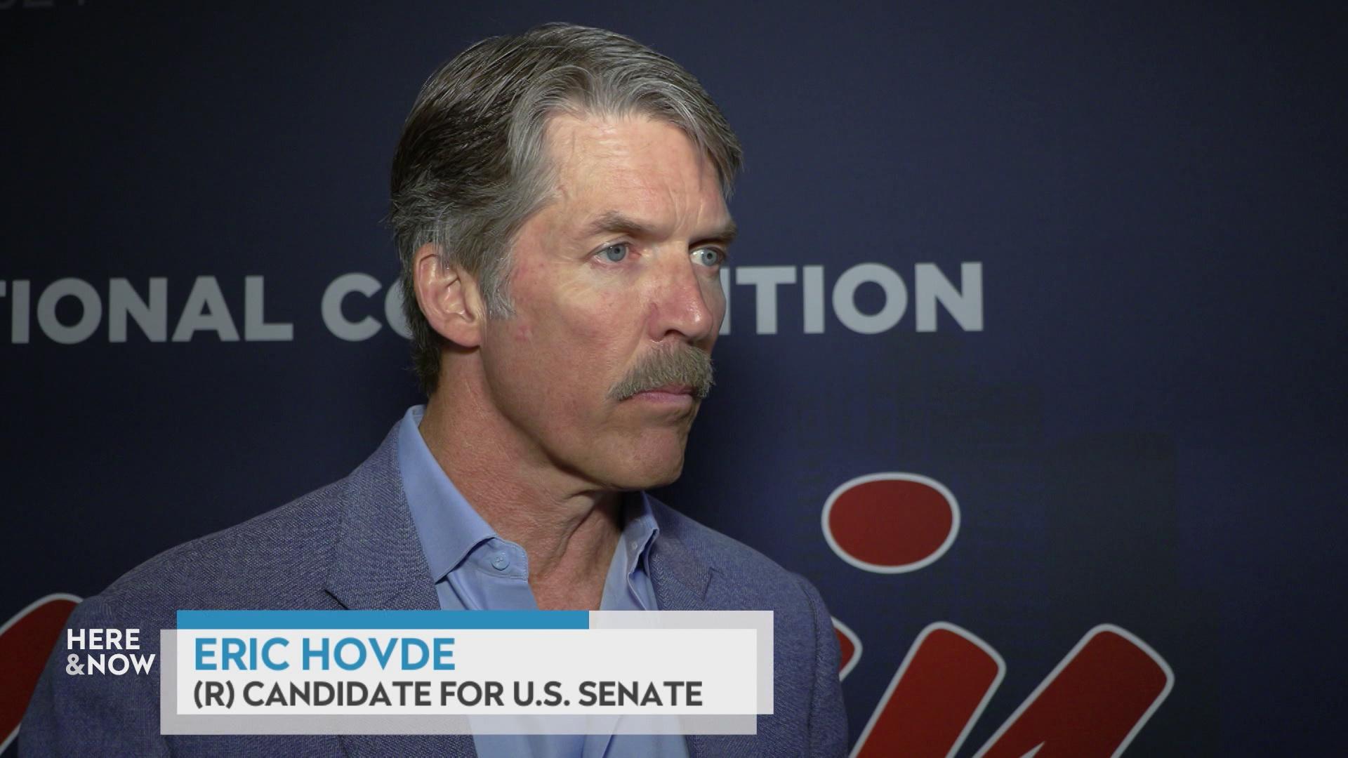 A still image shows Eric Hovde standing in front of a blue background with a graphic at bottom reading 'Eric Hovde' and '(R) Candidate for U.S. Senate.'