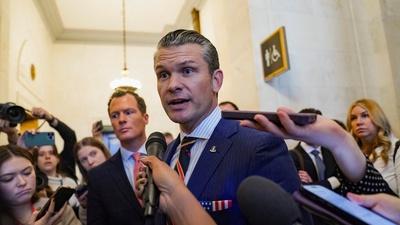 Trump sticking with Hegseth after a week of revelations