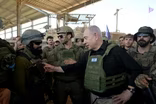 News Wrap: Netanyahu makes surprise visit to Gaza