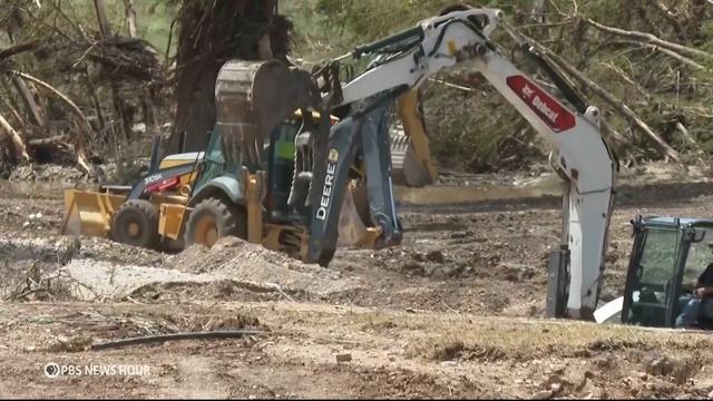 Crews peel away layers of flood debris in search for missing