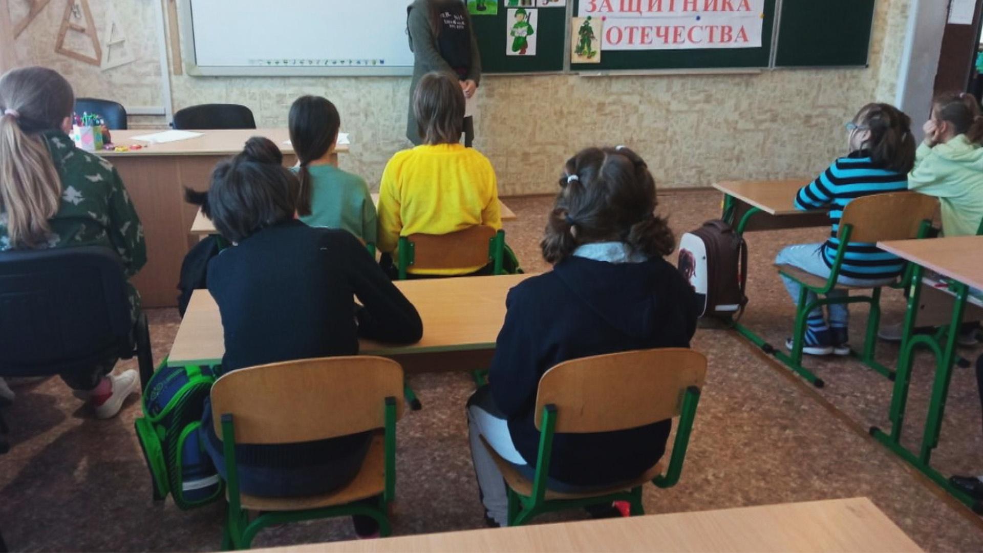 Group of children sitting at desks