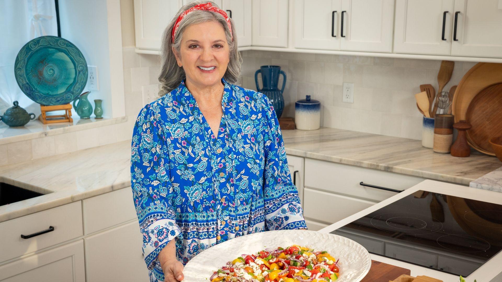 Host Sheri Castle holds a dish of watermelon rind slaw.