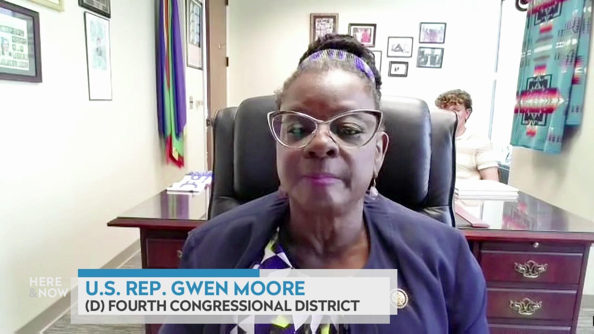 A still image shows U.S. Representative Gwen Moore seated in front of an ornate wood desk with a graphic at the bottom that reads 'U.S. Rep. Gwen Moore' and '(D) Fourth Congressional District.'