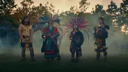 Dulé Learns the Mexica Handshake from Aztec Dancer Rainflowa