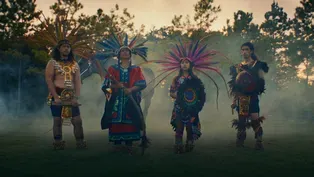 Dulé Learns the Mexica Handshake from Aztec Dancer Rainflowa