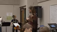 Rock Violinist Mark Wood Works With Middle School Strings