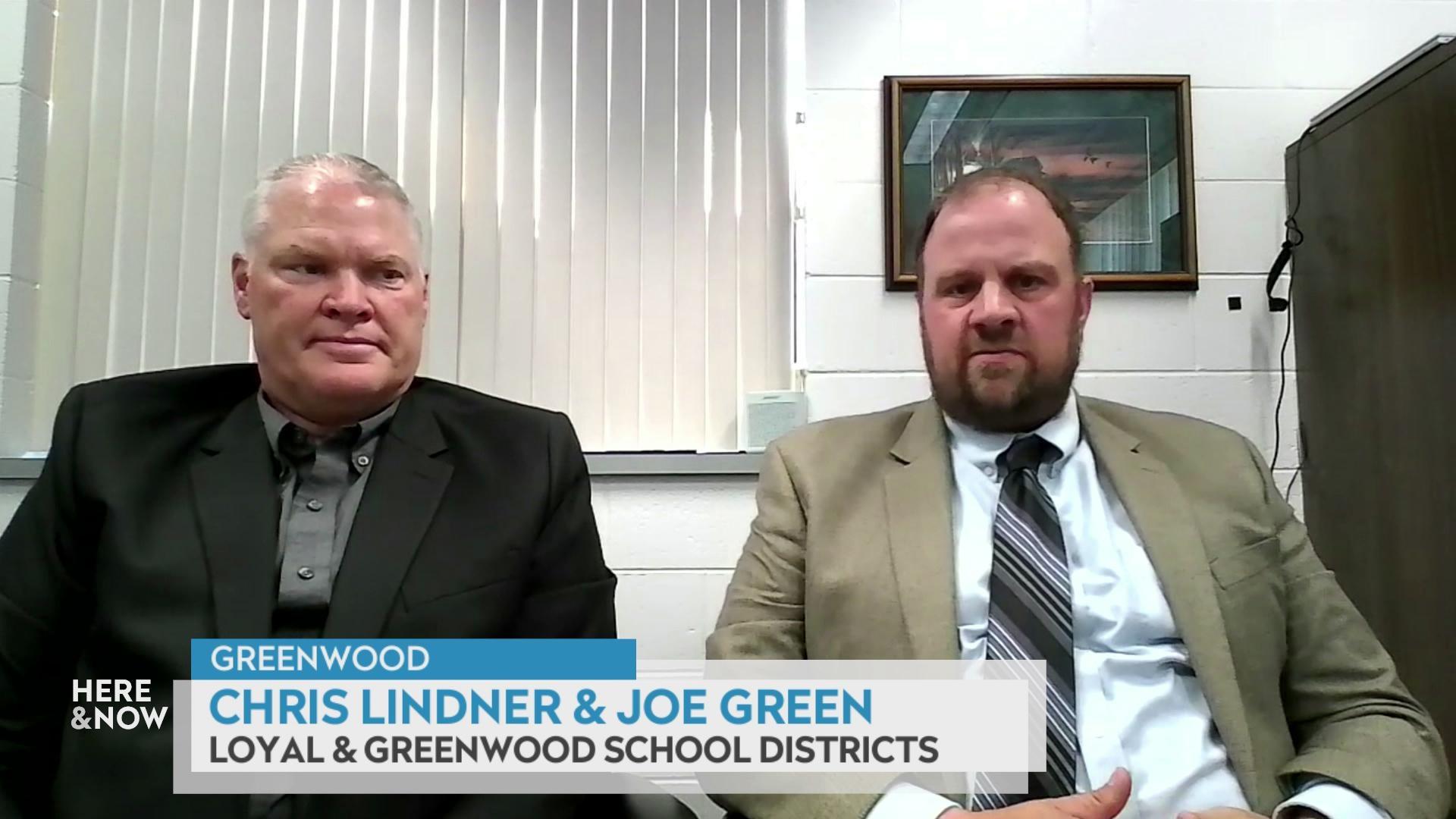 A still image shows Joe Green and Chris Lindner seated in an office with a graphic at the bottom that reads 'Greenwood,' 'Joe Green & Chris Lindner' and ' Greenwood & Loyal School Districts.'