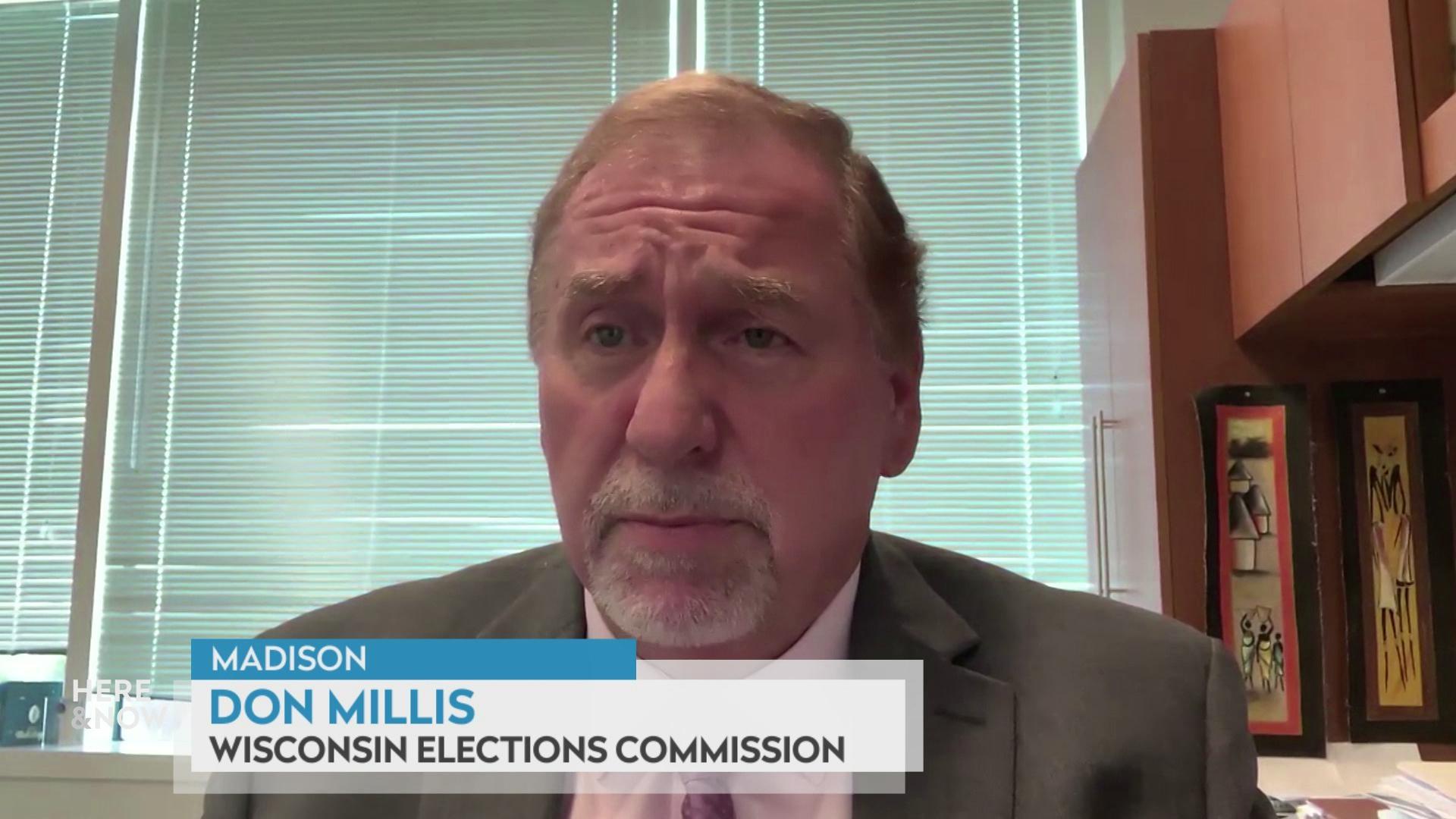 A still image shows Don Millis seated in front of a set of windows with the blinds closed, with a graphic at the bottom that reads 'Madison,' 'Don Millis' and 'Wisconsin Elections Commission.'