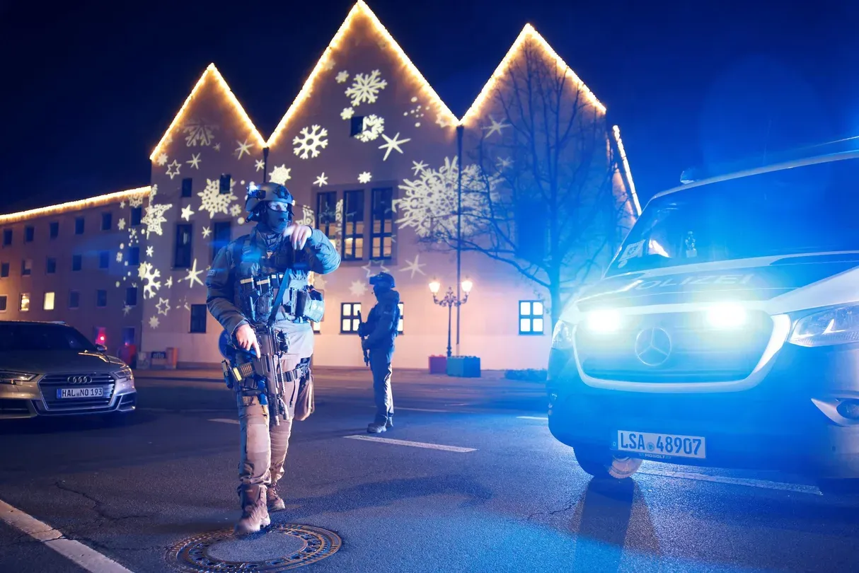 News Wrap: Man drives through German Christmas market