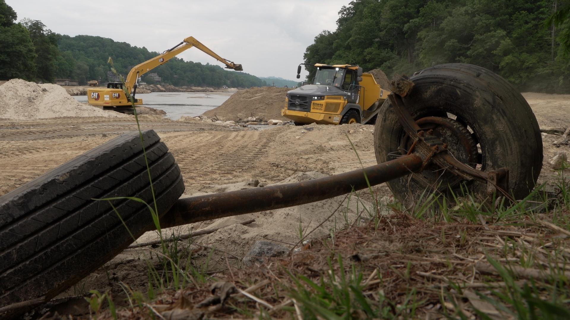 Tractors cleaning up debris on a river bank in western North Carolina.