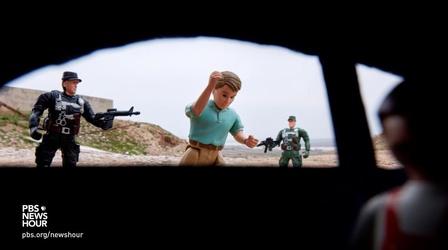 Video thumbnail: PBS NewsHour War photographer uses toys to tell child survivors’ stories