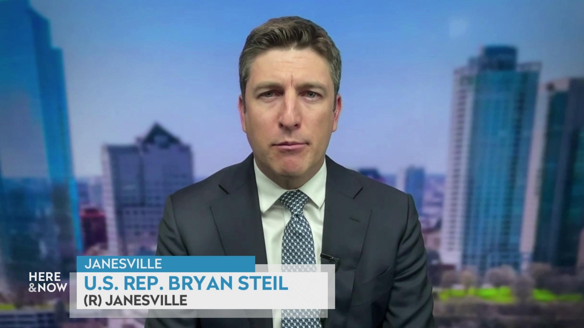 A still image from a video shows Bryan Steil seated in front of a cityscape filter background with a graphic at bottom reading 'Janesville,' 'Bryan Steil' and '(R) Janesville.'