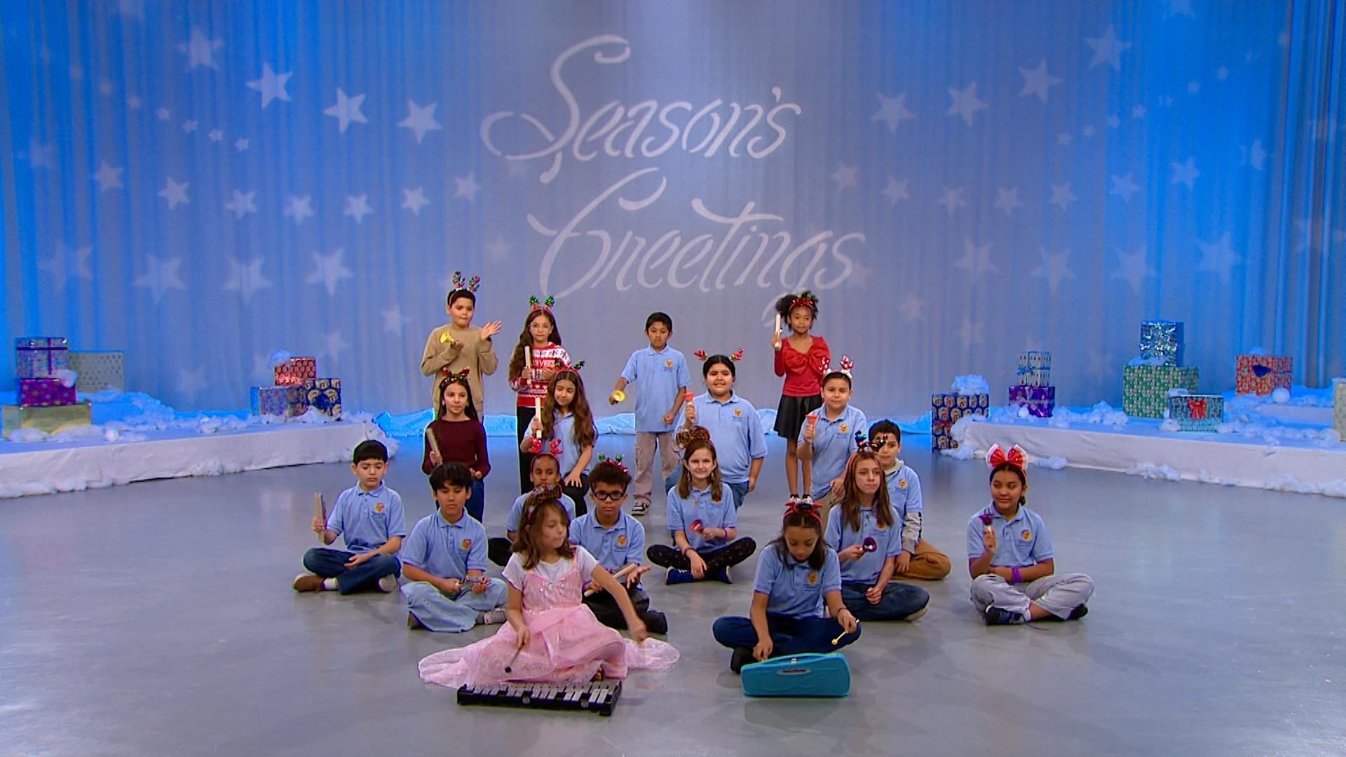 Students from Robert E. Lake Elementary School’s Bell Choir perform Carol of the Bells.