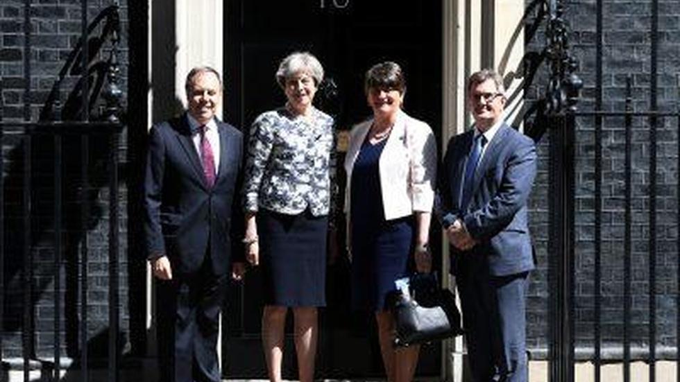 News Wrap: U.K.’s Theresa May strikes deal to bolster party image