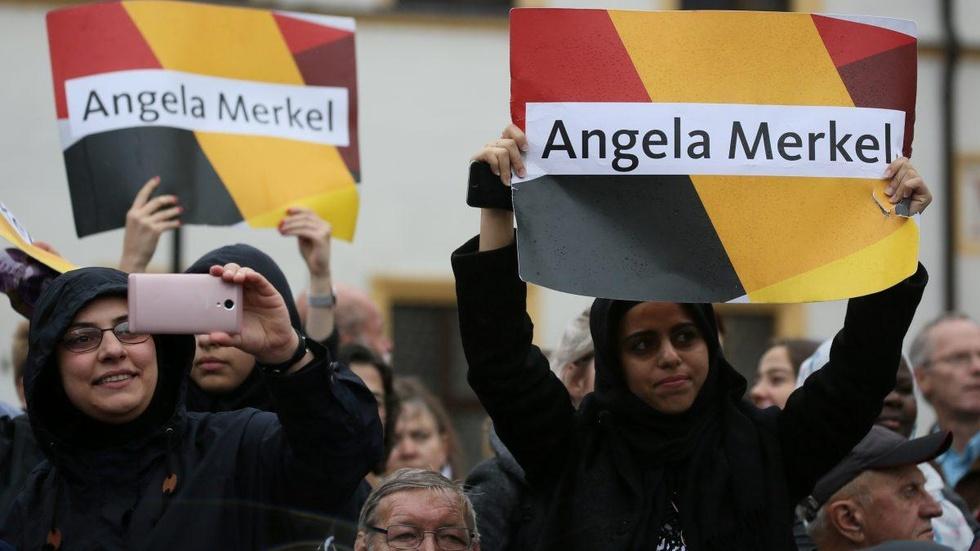 Merkel beating backlash to refugee policy in reelection bid image