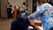 Frontline essential workers line up to get COVID-19 vaccine