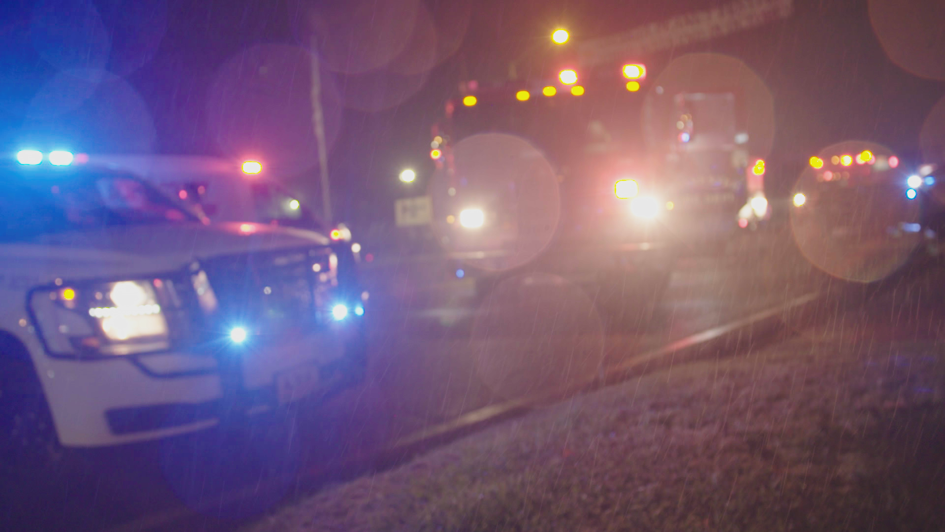 Police car lights bokeh blurred at night.