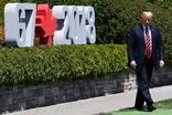 Trump keeps G7 attendance short at tense summit