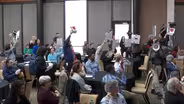Rutgers union members disrupt meeting, strike threat remains