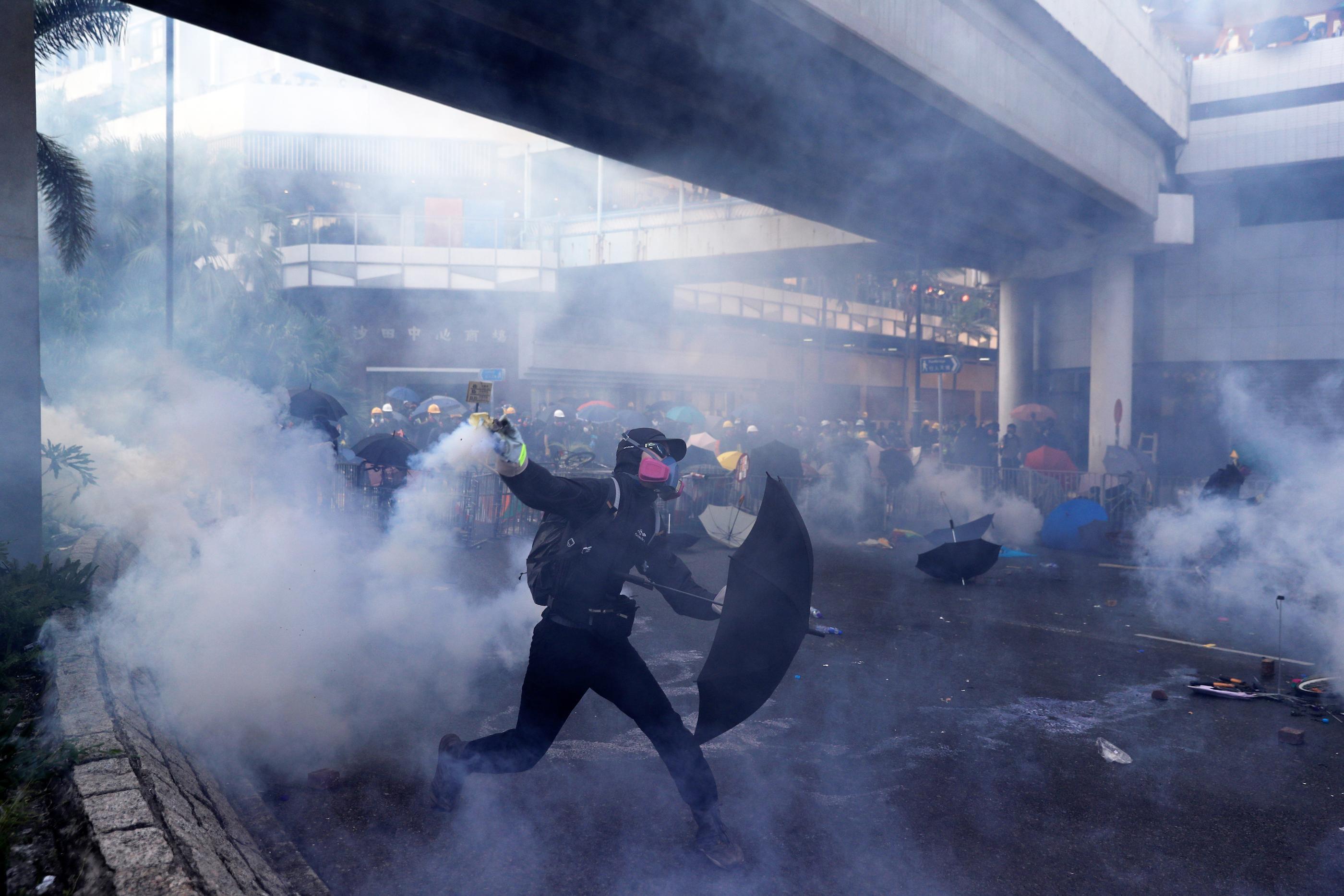 Hong Kong violence contrasts China’s anniversary pomp