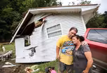 Thousands flee fires, flooding in California and Kentucky