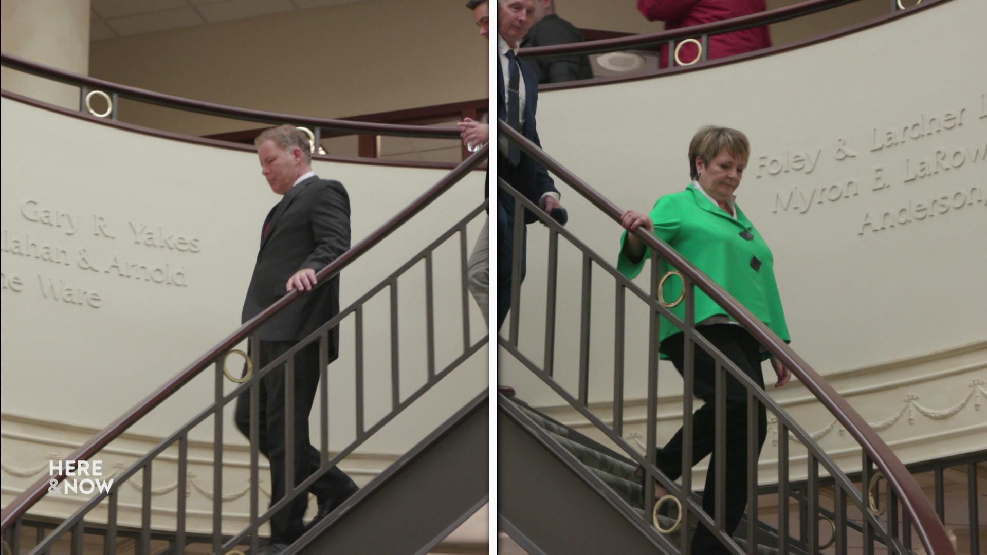 A graphic shows two side-by-side images of Daniel Kelly and Janet Protasiewicz descending a spiral staircase. 