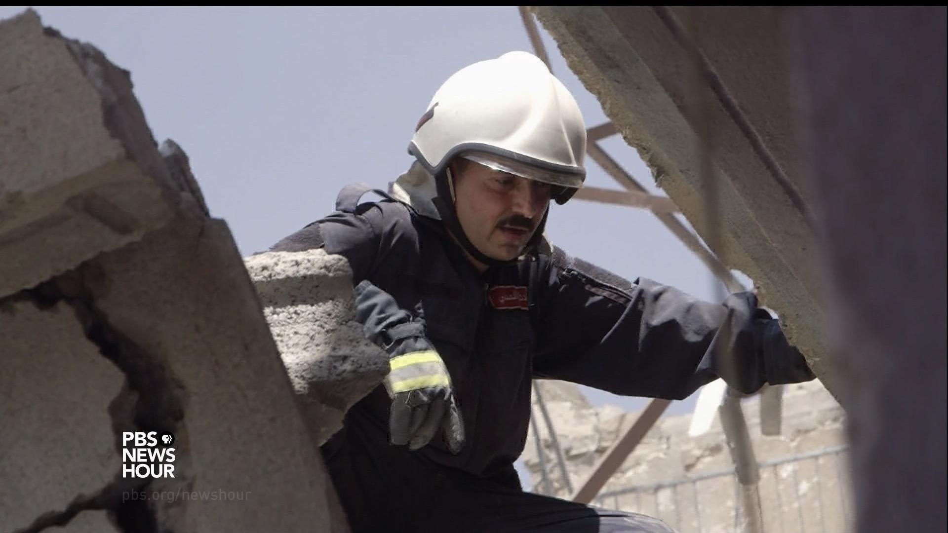 Mosul left in rubble, crews search for dead loved ones