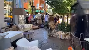 In Millburn, residents help businesses with Ida cleanup