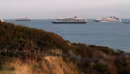Waiting to sail, idled cruise ships still attract visitors
