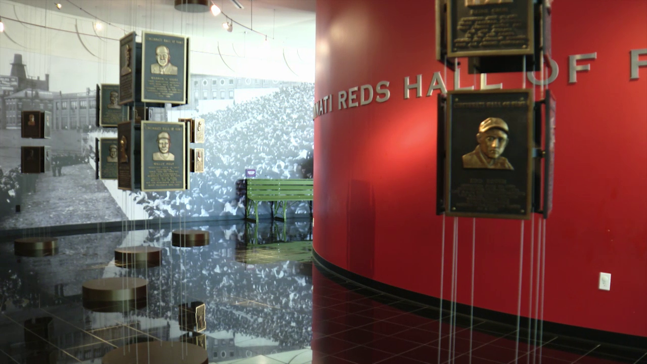 People tour the Cincinnati Reds Hall of Fame and Museum in