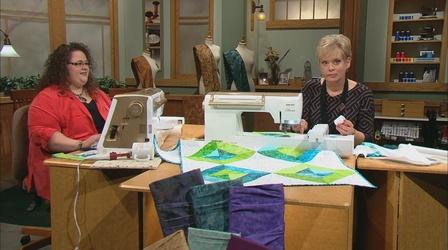 Video thumbnail: Sewing With Nancy Stress-Free Quilting With Machine Embroidery - Part 1